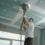 man polishing the ceiling